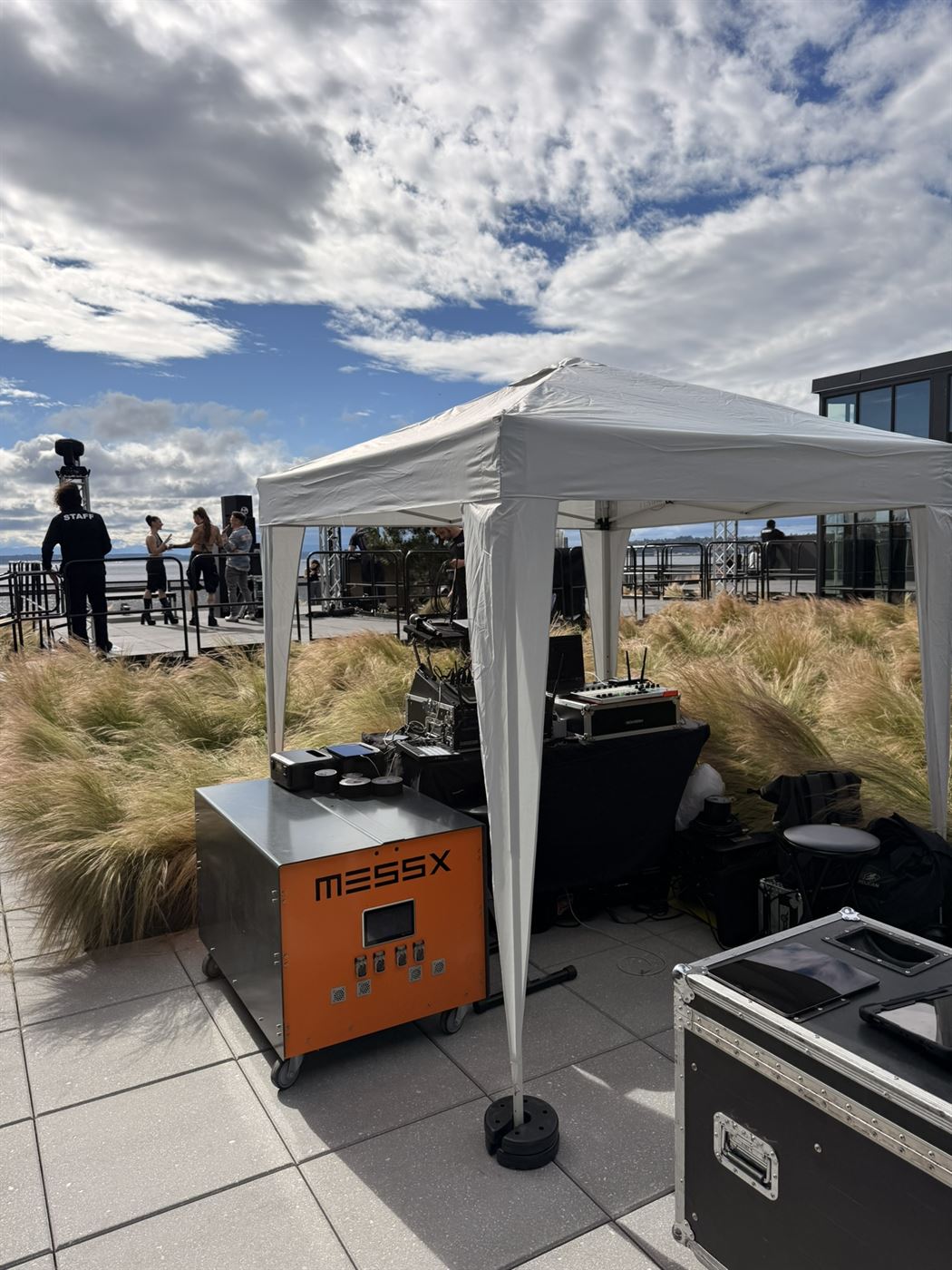 MESSX 10K powering the DJ booth and production tent on a Seattle rooftop, waterfront behind
