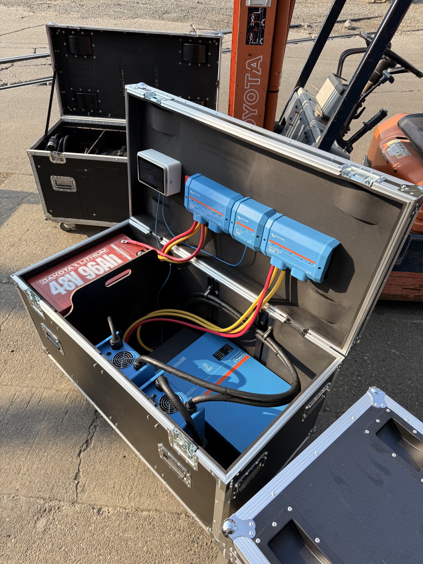 Roadie X open case showing the Dakota 48V lithium bank and Victron MultiPlus-II inverter/charger
